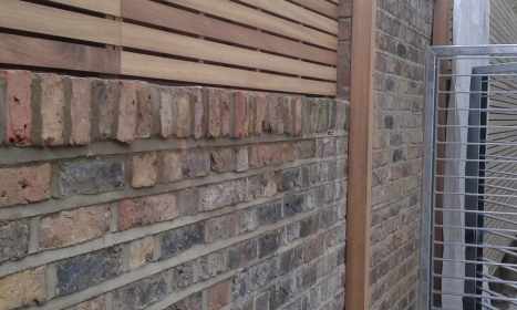 Natural Iroko Slatted Panels Fitted To Wall