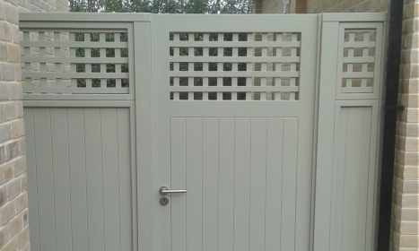 Solid painted gate with trellis top