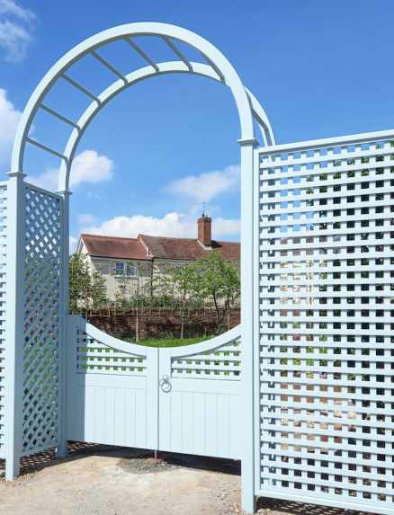 Square trellis 38mm gap, with diagonal trellis detailing, bespoke gate and rose arch all painted in Sea Smoke
