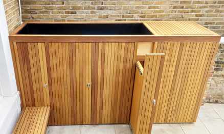 Bespoke Iroko Bin Store finished in a Honey UV treatment with a planter roof
