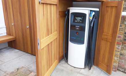 Bespoke Iroko Store with electric car charger cover
