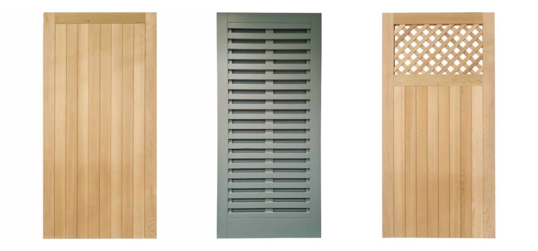 Three wooden doors on display: left is vertical slats, middle is slatted green, right is lattice top with vertical slats.