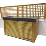 Wooden outdoor cabinet with a dark top, lattice backing, and white side panels.