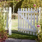 The back of an open picket gate painted in Orford Cream