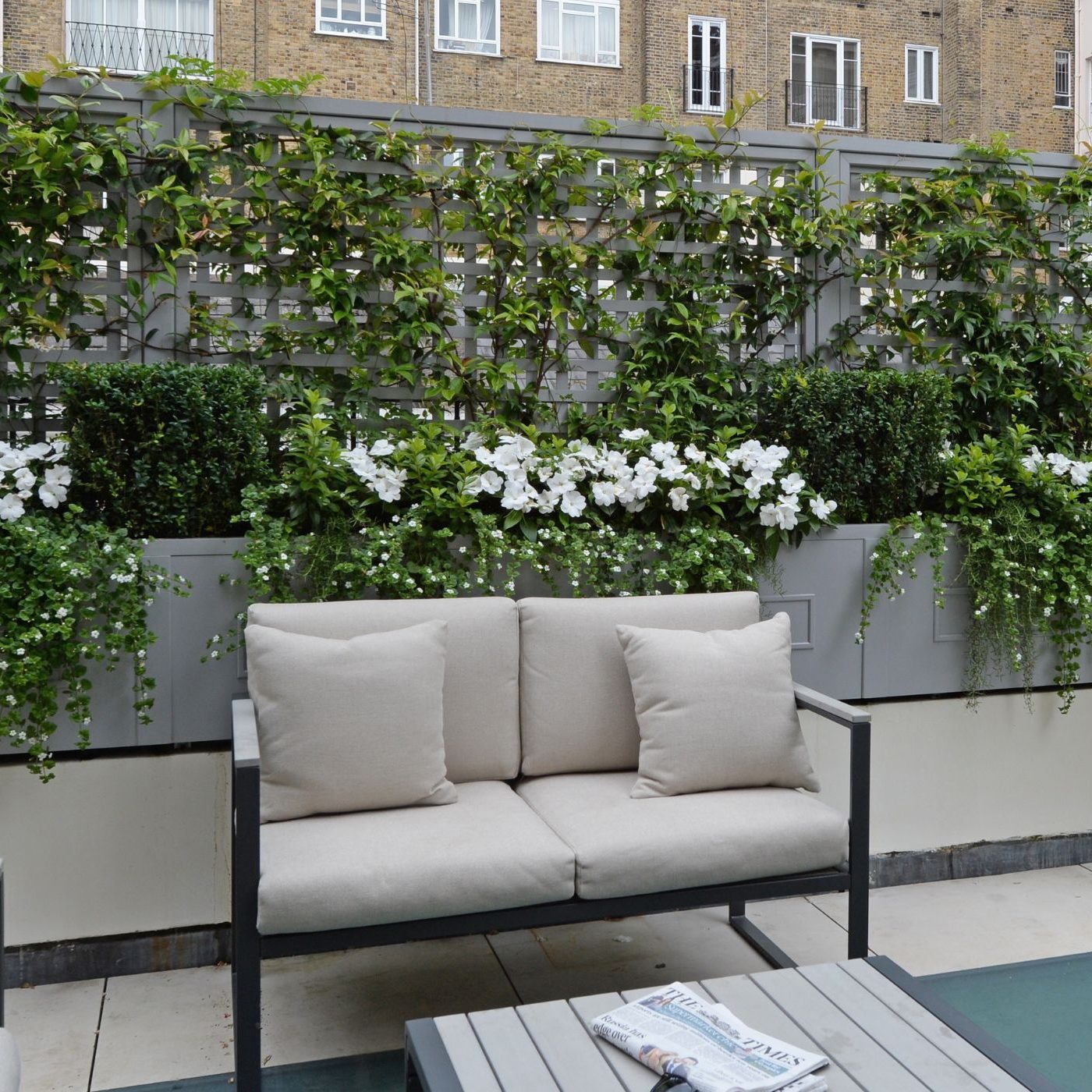 Bespoke trellis and filled planters on a rooftop garden