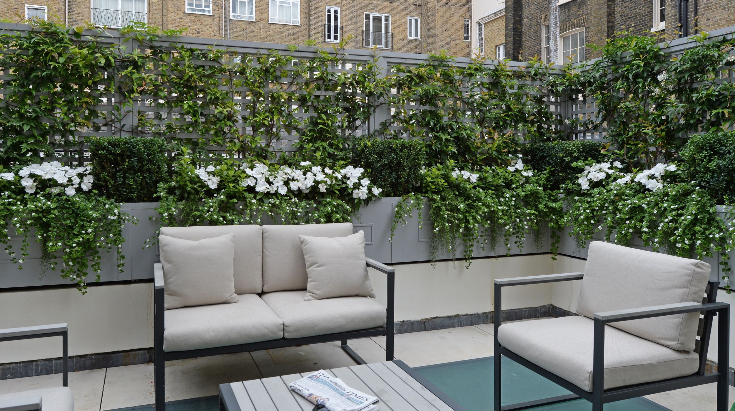 Bespoke trellis and filled planters on a rooftop garden