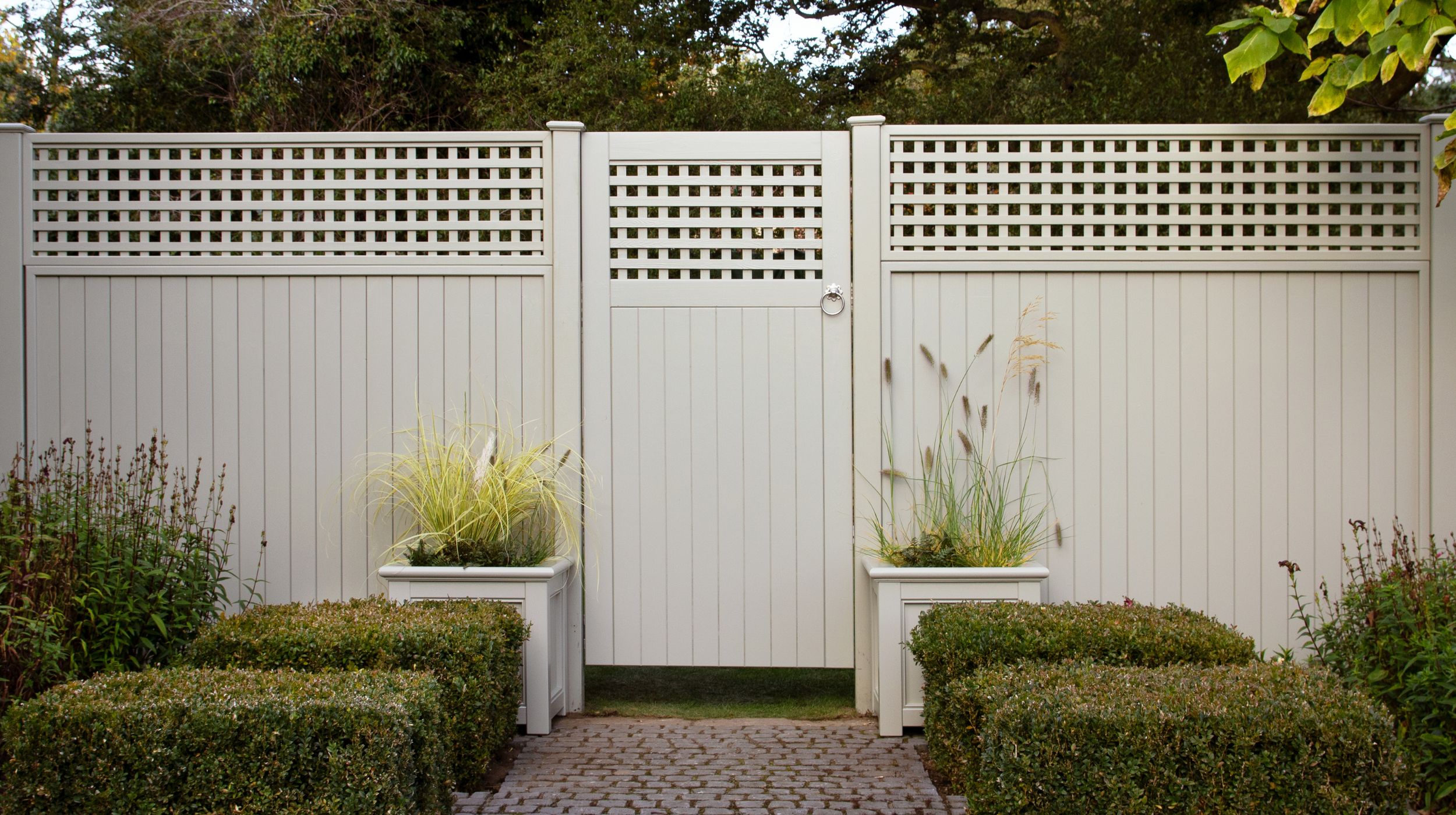 RHS Prestige gate, trellis and fencing in a formal garden