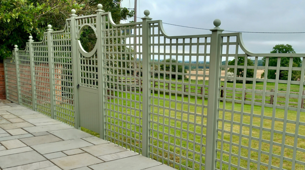 Decorative bespoke gate and square trellis painted in Farrow & Ball Lichen