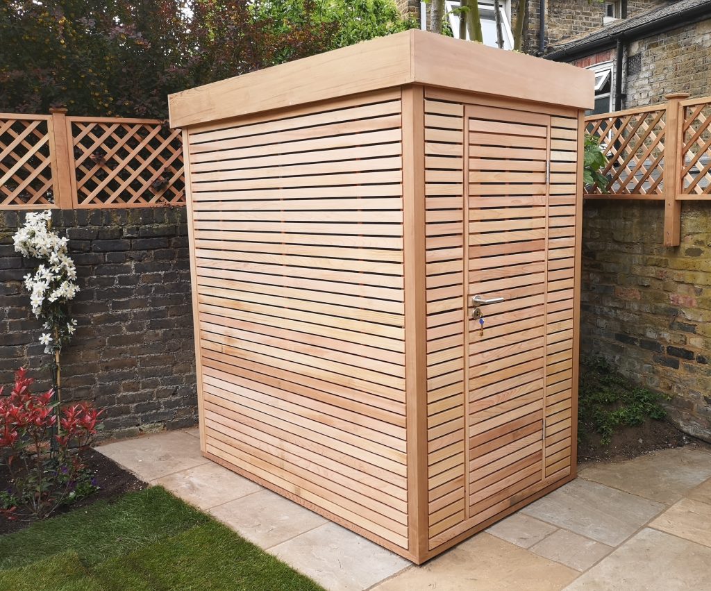 RHS Prestige Contemporary Shed with RHS Prestige Diagonal Trellis behind