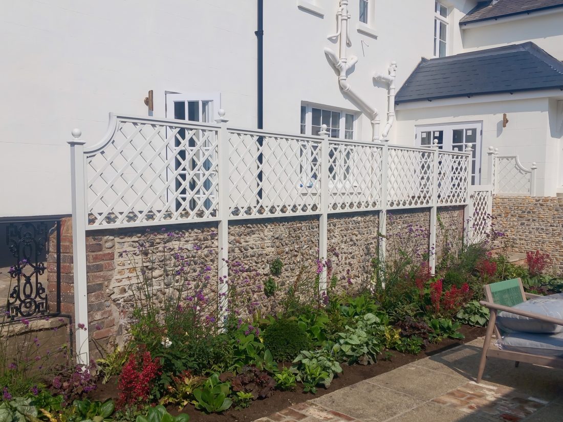 Bespoke diagonal trellis panels (100mm gap) with matching gate painted in F&B Wymborn White
