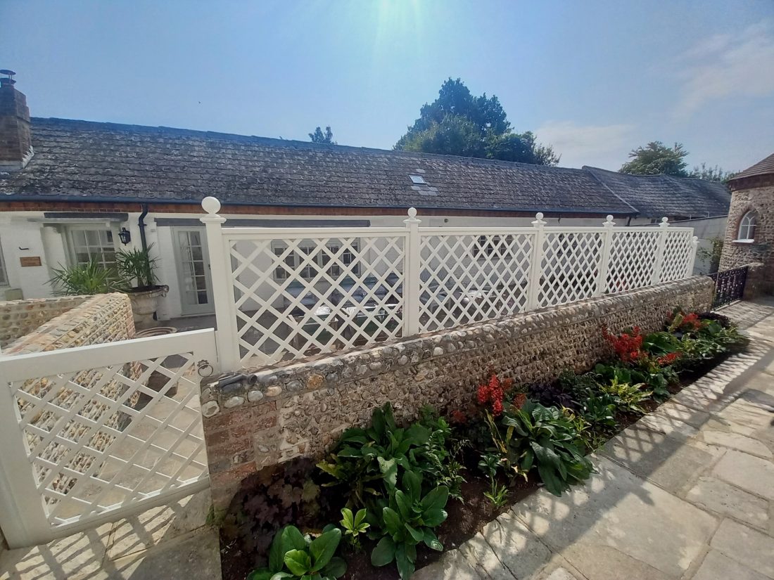 Bespoke diagonal trellis panels (100mm gap) with matching gate painted in F&B Wymborn White
