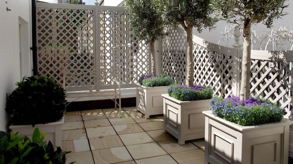 Bespoke Planters and Trellis painted Orford Cream in a formal courtyard garden
