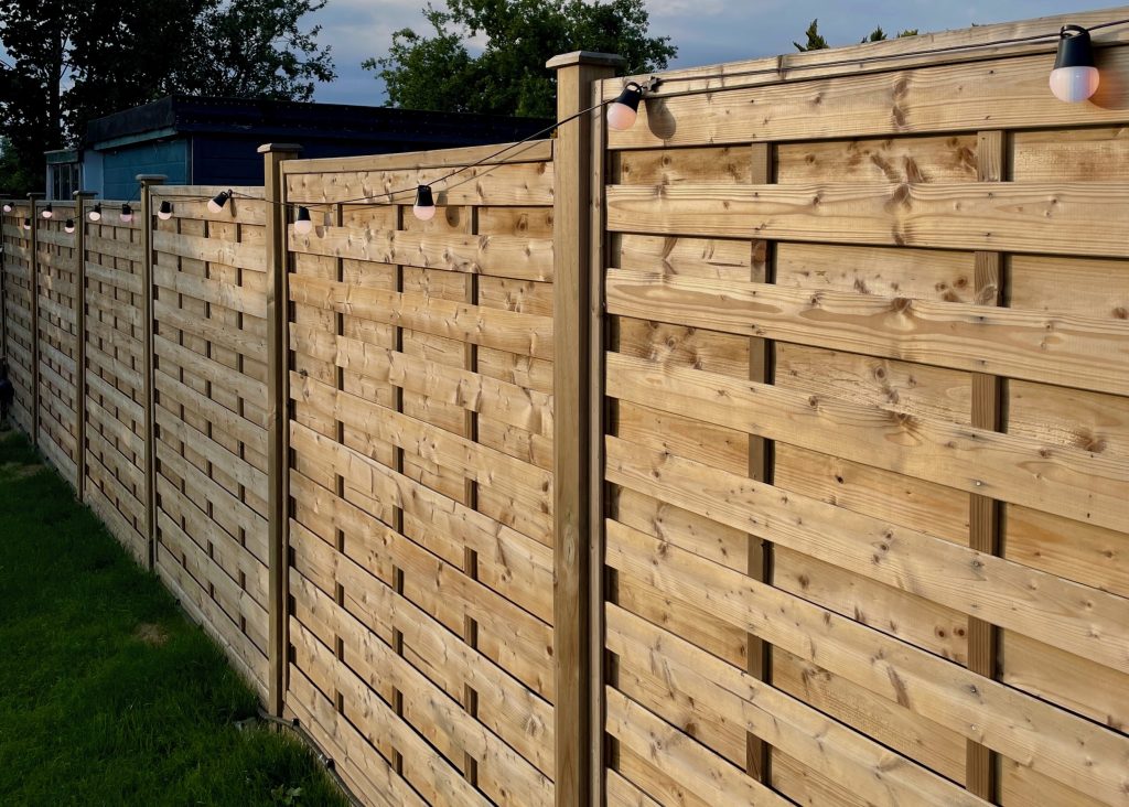 Solid Fencing with string lights