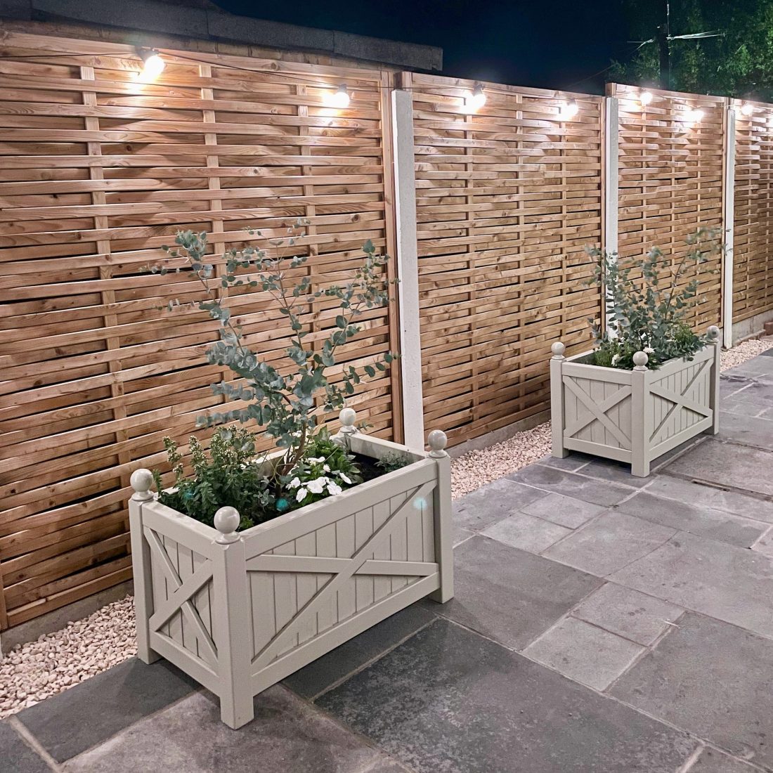 Weave Fence Panels and painted planters at night