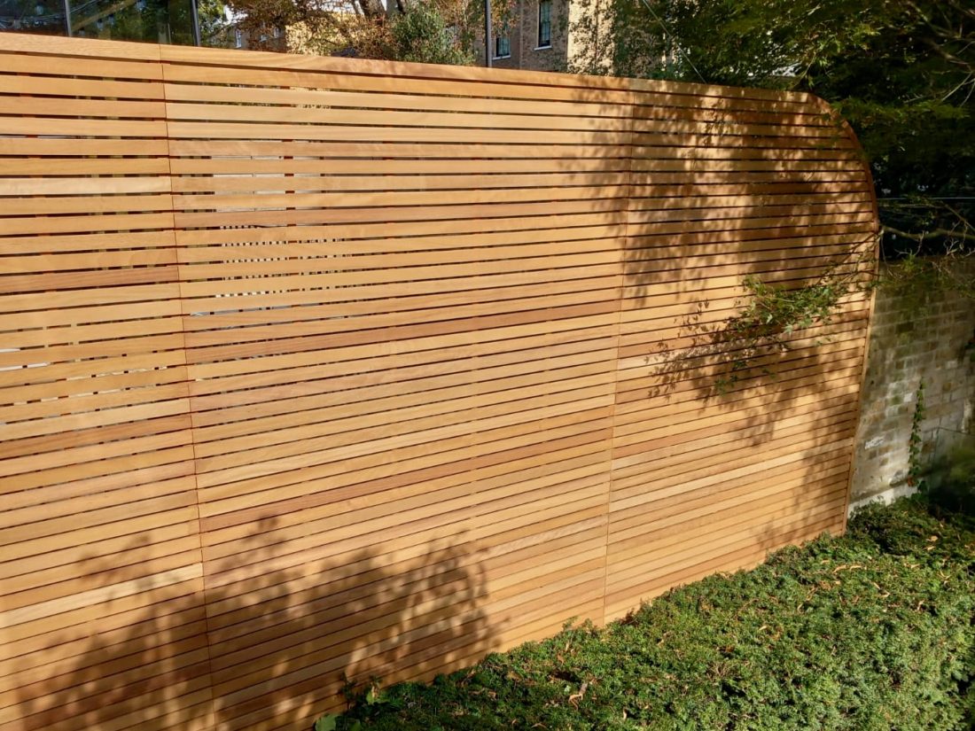 Bespoke Slatted Panels (45mm slat/10mm gap) with curved edge in Iroko