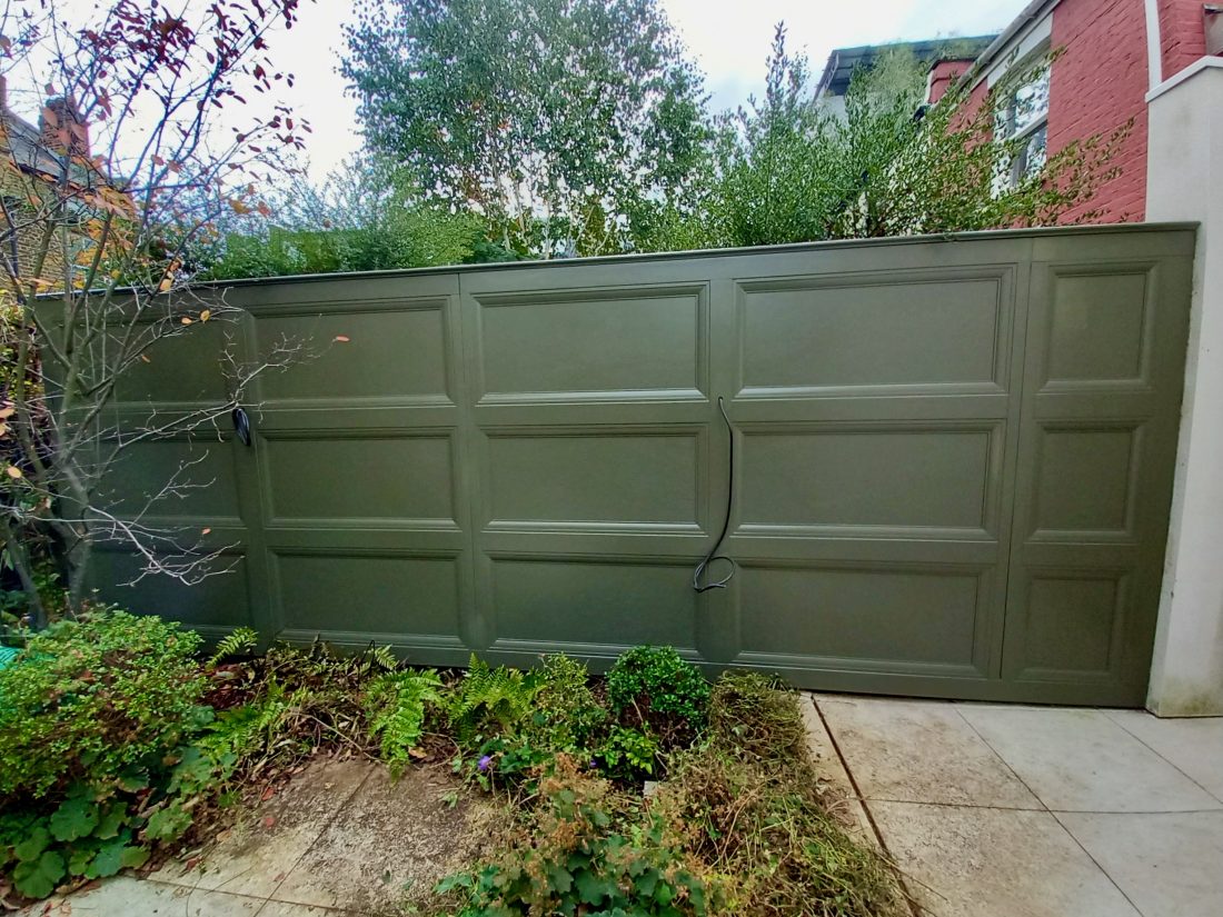 Bespoke ‘panelled’ solid fencing, painted in Benjamin Moore Dark Olive