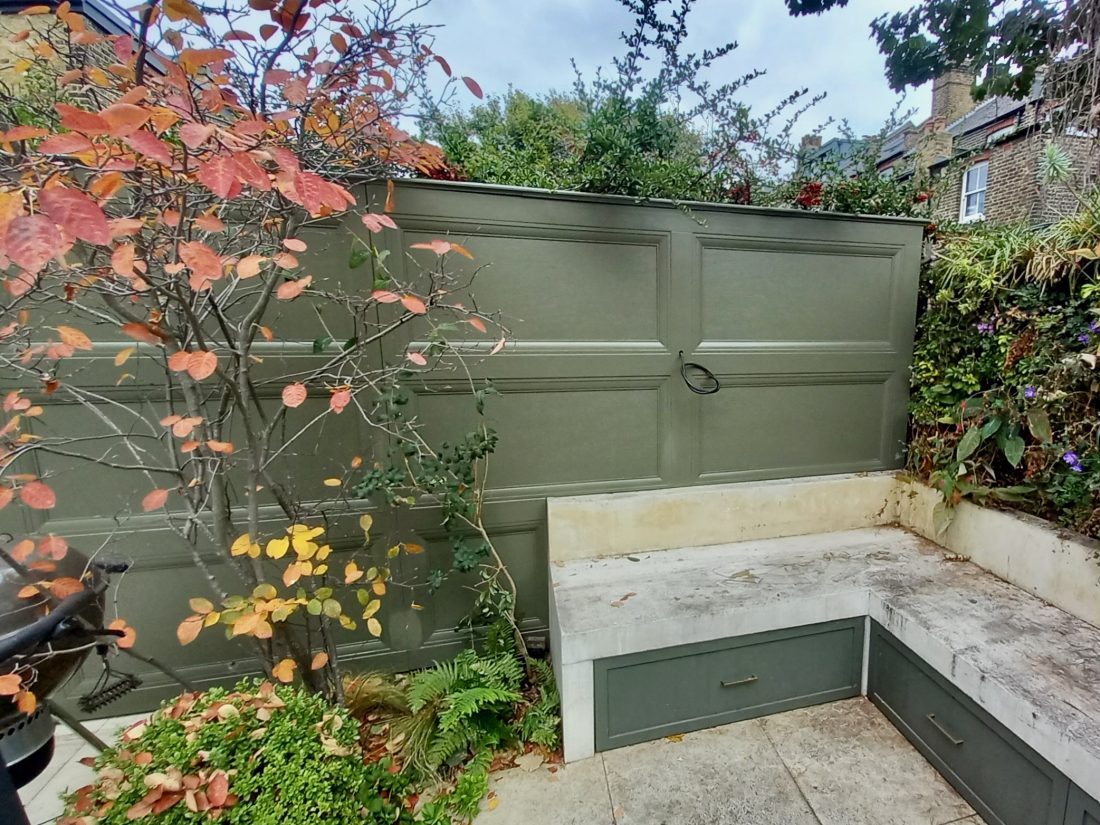 Bespoke ‘panelled’ solid fencing, painted in Benjamin Moore Dark Olive