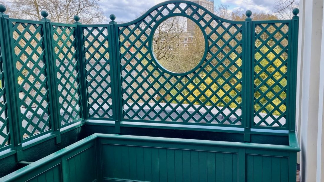 Bespoke trellis-backed planters painted in Alpine
