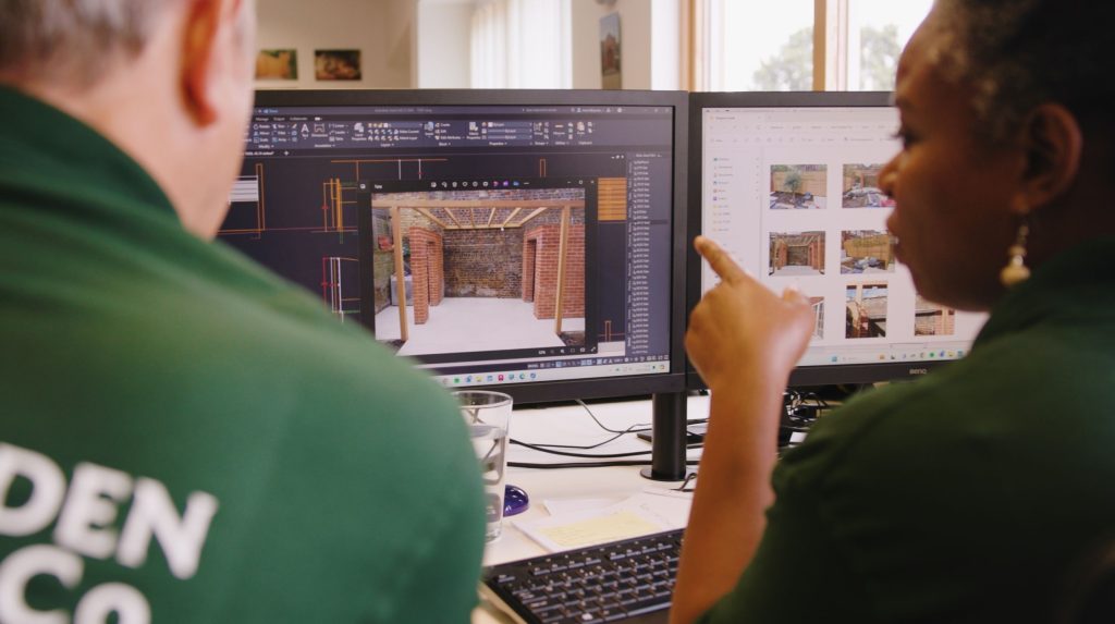 Project managers discussing a bespoke pergola