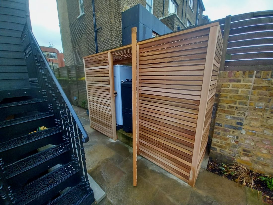 Bespoke slatted air conditioning acoustic enclosure, 45mm slat with a 10mm gap in Western Red Cedar
