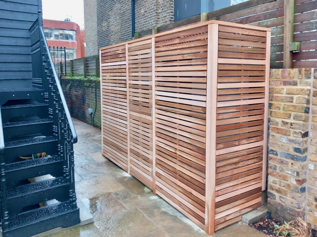 Bespoke slatted air conditioning acoustic enclosure, 45mm slat with a 10mm gap in Western Red Cedar