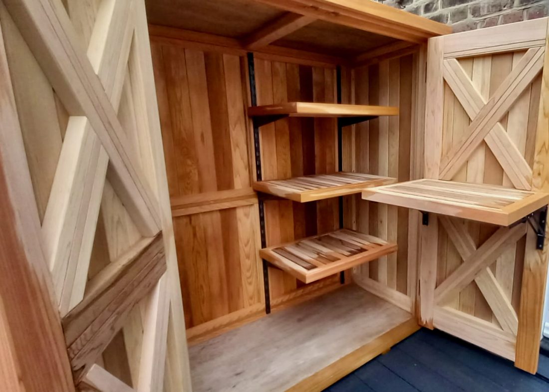 Bespoke store in Western Red Cedar, with double doors, interior shelving and pop-up table