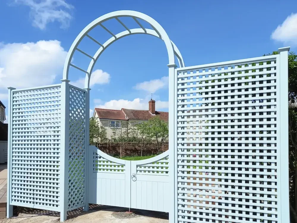 Square trellis 38mm gap, with diagonal trellis detailing, bespoke gate and rose arch all painted in Sea Smoke